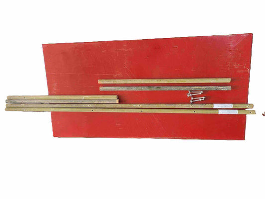 Trellis kit components including wooden posts, support bars, and hardware for blackberry plants.
